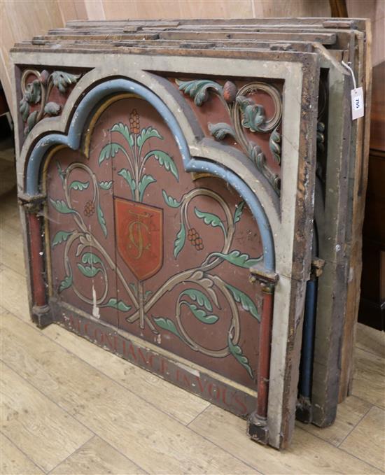 A set of three 19th century French ecclesiastical panels, painted with monograms within acanthus carved borders W.127cm approx.